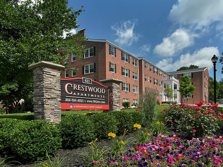 Vibrant landscaping and welcoming signage at Crestwood Apartments in Wayne, PA