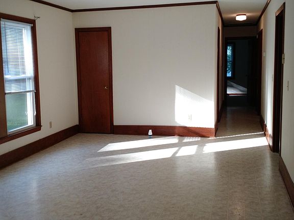 View from carport door thru Dining room and down hallway to Master bedroom