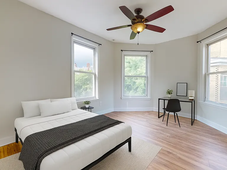 Second bedroom with beautiful windows and light overlooking the yard