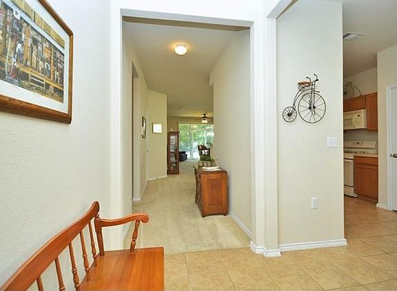 Welcome home! The wide entry foyer flows into the living/dining area as well as...
