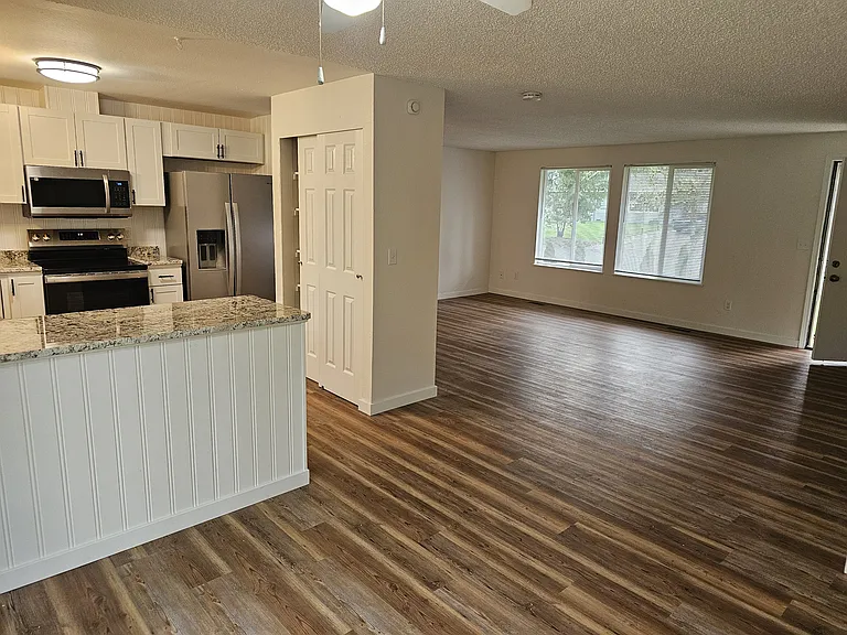 View from dining area of kitchen and living room.