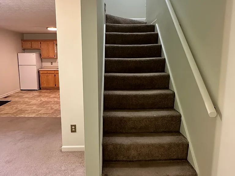Stairs to upstairs bedrooms & bath