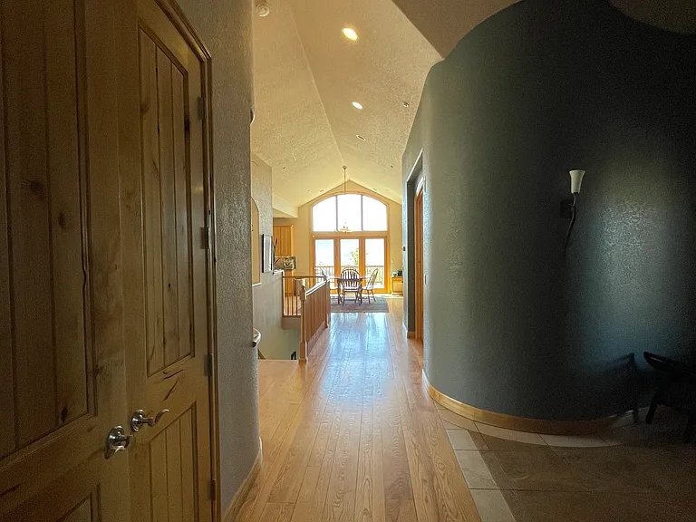 Hallway from bedrooms to entrance, kitchen, and living room.