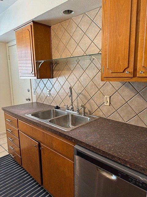 Galley kitchen with maple cabinets
