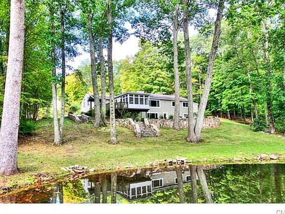 The pond is tranquil enough for reflections, but is constantly moving over the newly rebuilt dam.  Just a lovely setting.