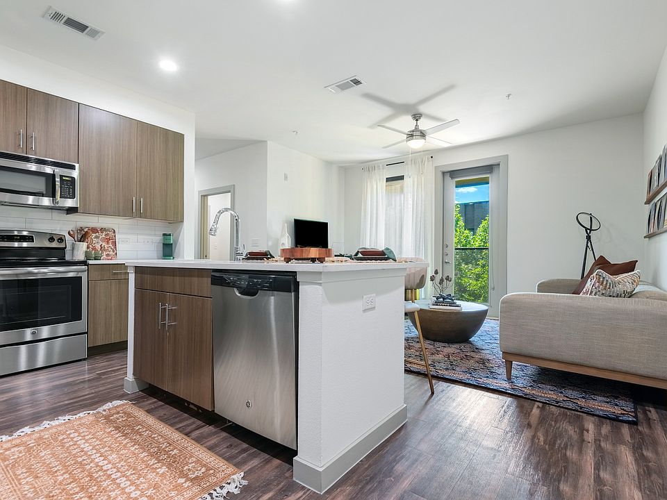 Open-Concept Layout with Kitchen Island and Cozy Living Area