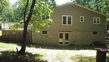 View of the large walk-out basement, side deck, and back-yard.br