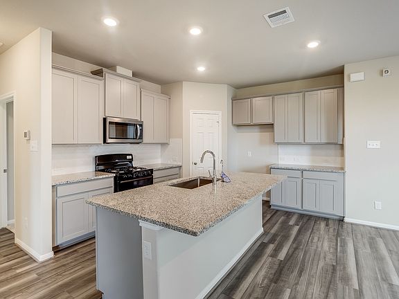 Kitchen with island overhang for additional seating