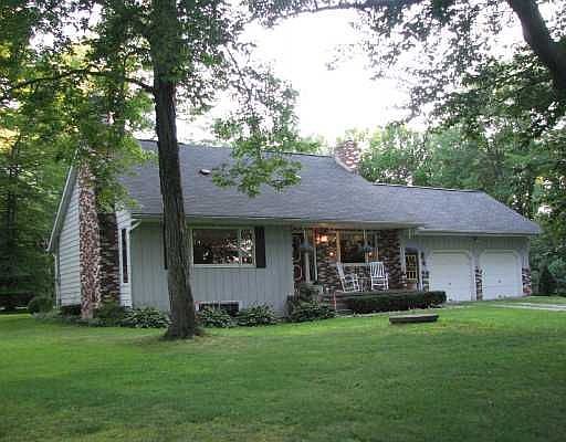 6041 Old State Road nestled in the woods