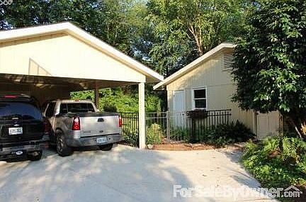 Carport and side-door entrance
						:
						The carport was added in 2003 when the garage was closed in to add living room.