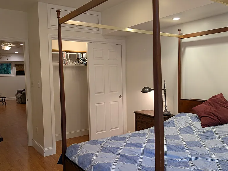 Bedroom looking into living area. Large closet and built in cabinet