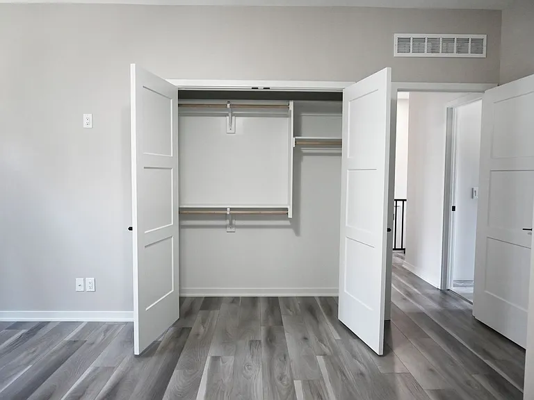 Master bedroom closet in room.