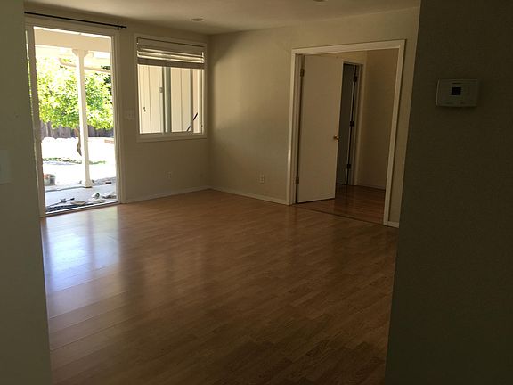 Right side of great room, dining space. Large slider that goes to yard. Double doors lead to family room, laundry, one Master and bath.