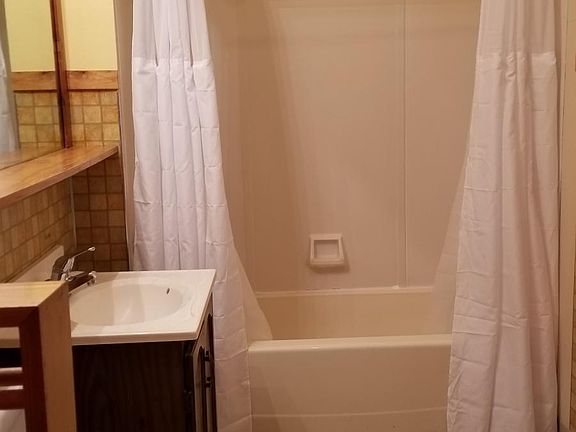 first floor bathroom with bath tub