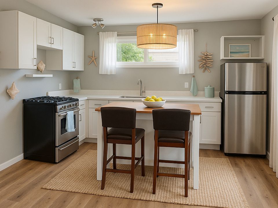 Kitchen with center island-virtually staged. Decor is not included.