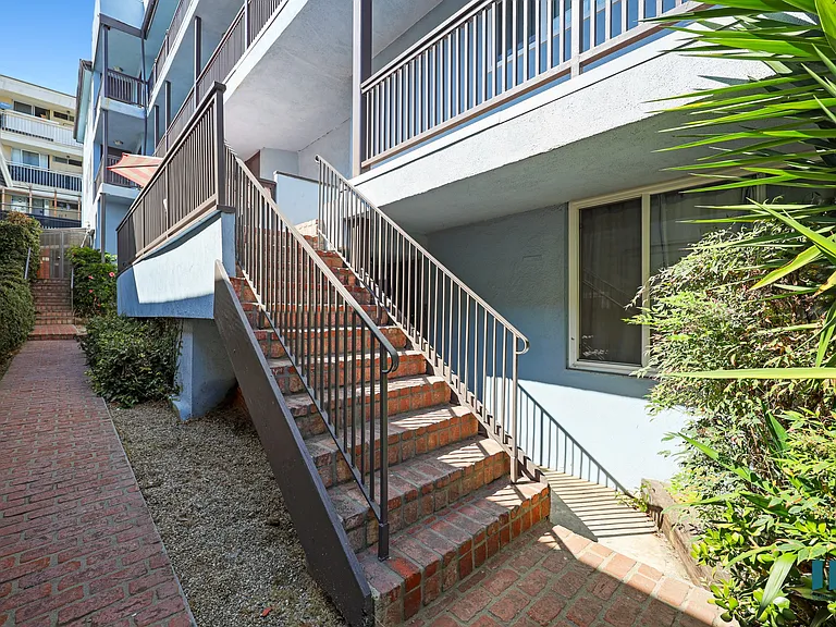 Side Exterior and Staircase to Upper Level