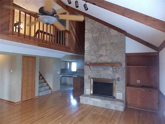 Another view of 18x20 Great room with cathedral ceiling and tract lighting.