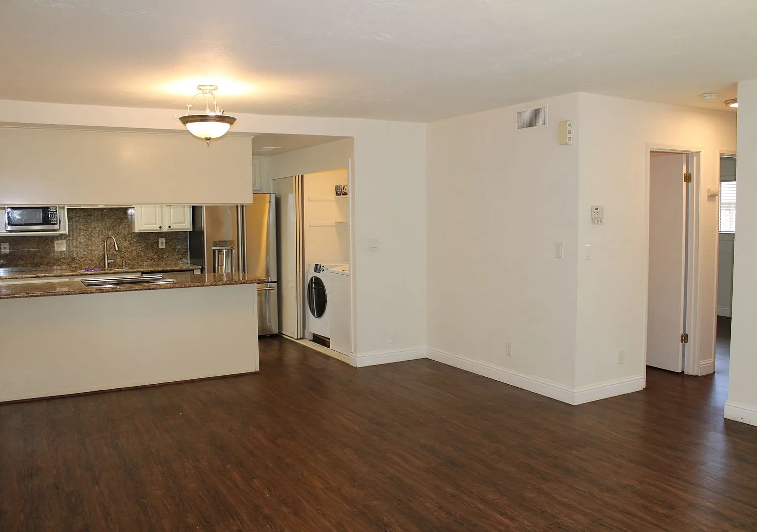 Adorable and Updated 2 Bedroom, 1 1/2 Bathroom End Unit in Sunset Park with Garage and Amenities! — Photo 3