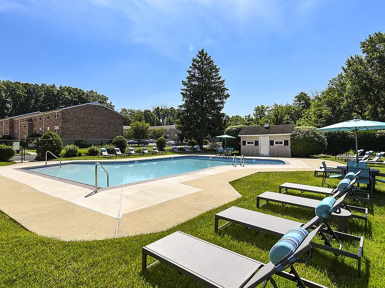 Outdoor pool with lounge chairs