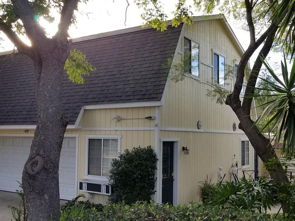 Side door is the entrance to the mud room and stairs.