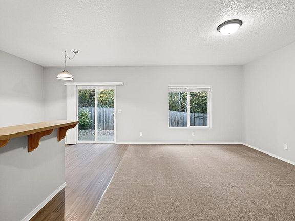 Very spacious kitchen, dining and living room. Carpet was just replaced with luxury vinyl flooring.

Not shown: Updated dining light fixture and ceiling fan installed in living room