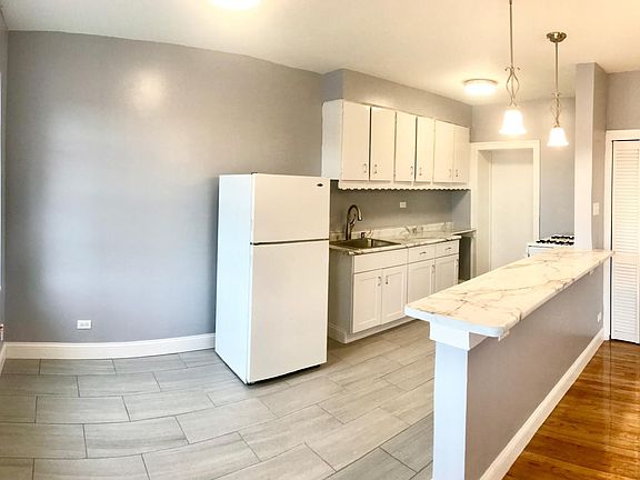 Kitchen (includes stove & fridge)