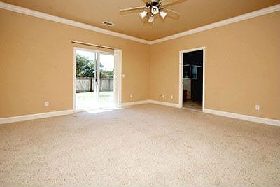 Master bedroom w/glass slider to backyard