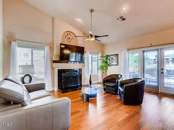 Family room has wood burning fireplace