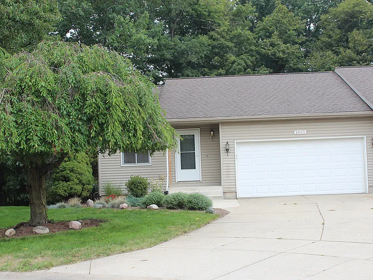 Front view of duplex with double garage