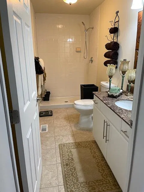 First-floor full bath adds convenience and functionality to the home's layout. It creates an ensuite for the first-floor bedroom, providing a perfect setup for guests or multi-generational living with a full bedroom and bathroom right on the main level.