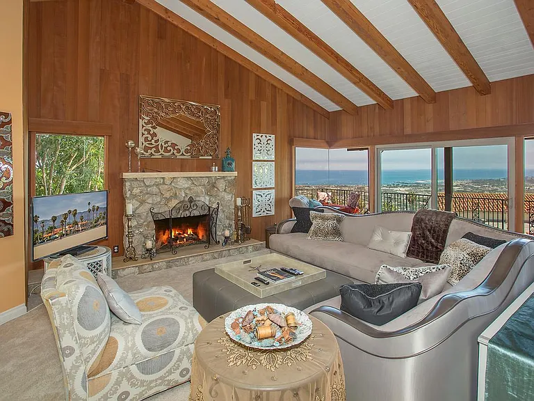 Savor panoramic views of the ocean and harbor while relaxing or entertaining loved ones in the expansive living room.
