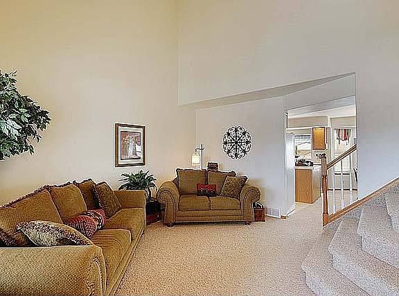 The living rm is conveniently located off the kitchen for formal entertaining.