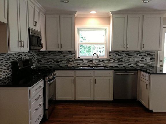 Completely remodeled kitchen has it all! Brand new stainless steel appliances, an extra deep under-m