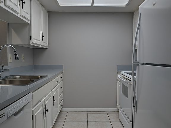 The galley kitchen has many updates, including a new fridge.