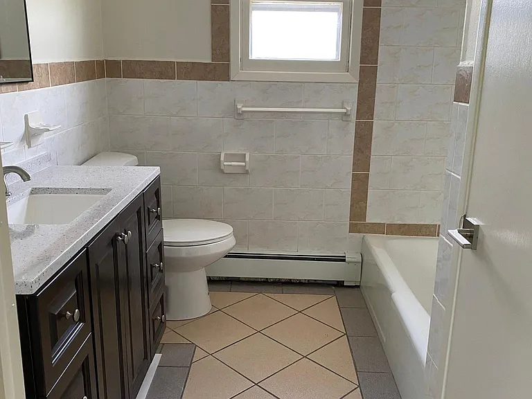 Great bathroom. Good lighting. New 48" vanity. Freshly painted. Storage closet.