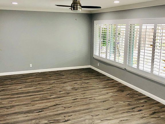 Family room with stainless steel ceiling fan