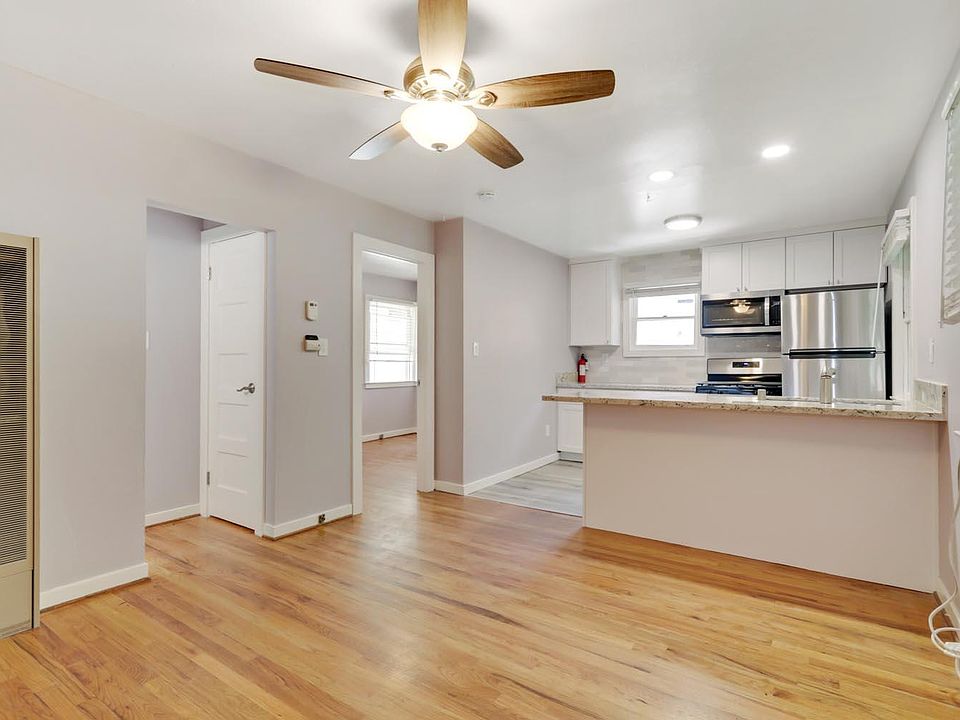 Original white oak top-nail floors throughout apartment.