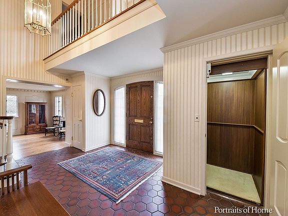 Elevator in foyer goes to all three levels