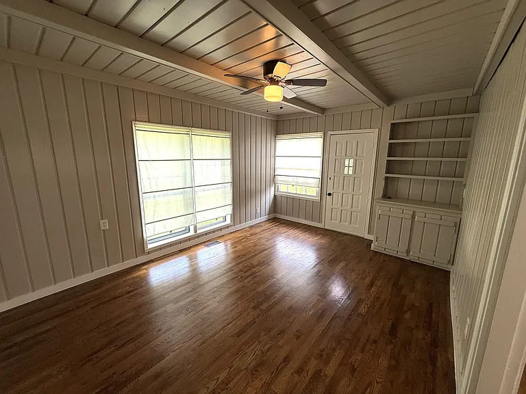 Versatile flex room that can be used as a home office, playroom, guest space, fitness room, or second living area