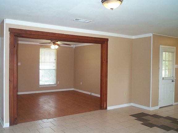 Livg room with old beam cased opening.