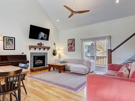 open floor plan living room with fireplace