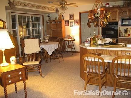 Kitchen
						:
						looking forward, doorway enters into small hall to laundry room,right & BR left