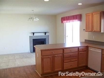Fireplace with Dining Area
						:
						Note this carpet has been replaced with Native Palm Hampton Bay flooring.