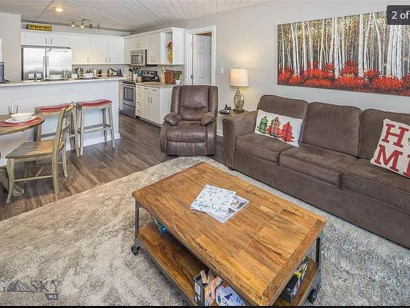 Comfortable furnishings in great room with dining area and breakfast counter