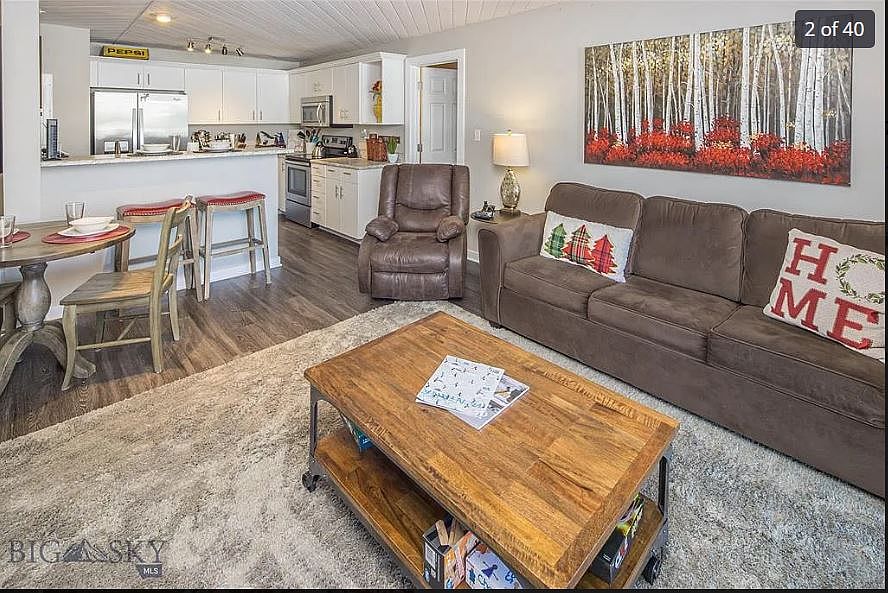 Comfortable furnishings in great room with dining area and breakfast counter