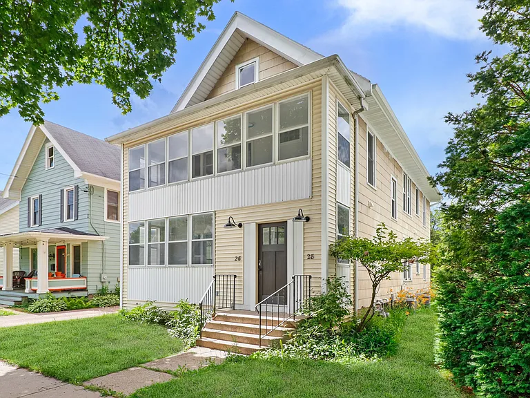 HELLO GORGEOUS!! Amazingly remodeled two flat. Each unit is integral and whole. Truly Beautiful. Recent new paint job a light blue grey. Lovely