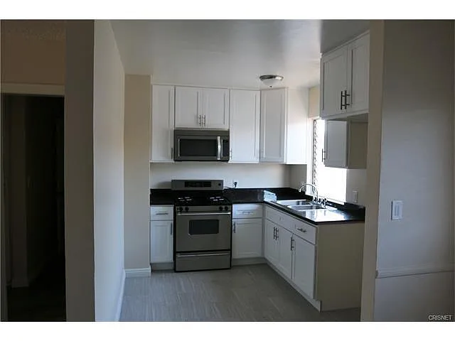 Building Photo - 6925 Whitsett Ave #1