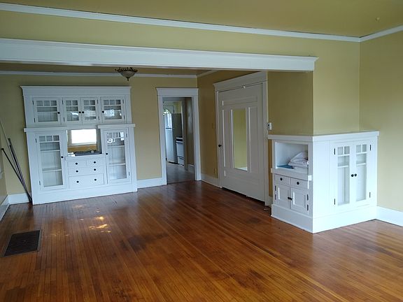 Built in china cabinet, pivoting, mirrored door leads to office space.
See next pic