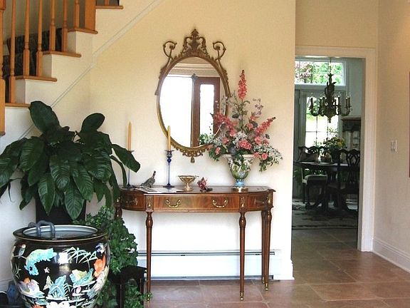 Welcoming Foyer offers Chandelier w/Electric Lift