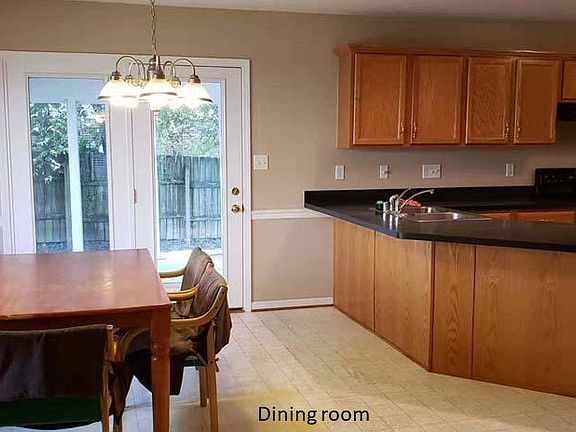 Dining room with bay window and access to sunroom